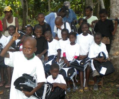 Children Receiving Backpacks