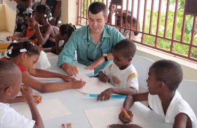 A volunteer working with children